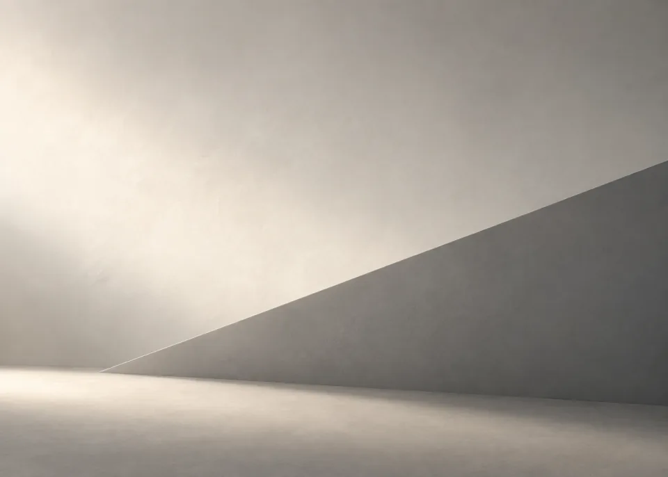 Folded Plane: Two pale warm gray plaster planes meet diagonally below center, diffuse ivory light on one surface and cool gray shadow on the other.